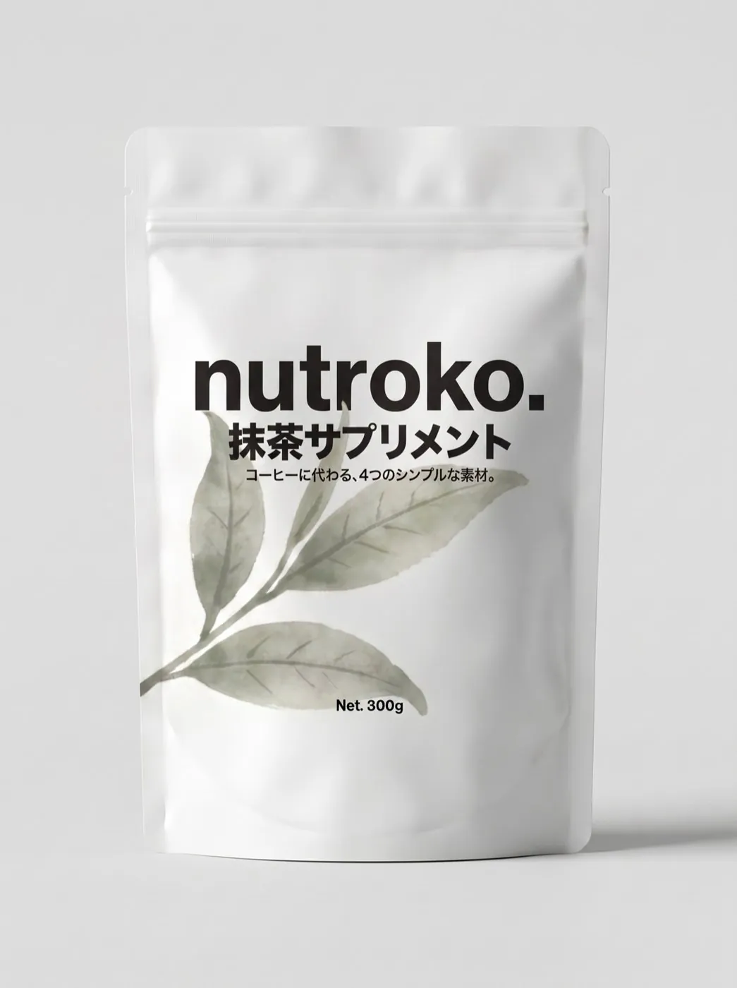 A white Nutroko pouch with watercolor tea leaves, photographed against a plain light background